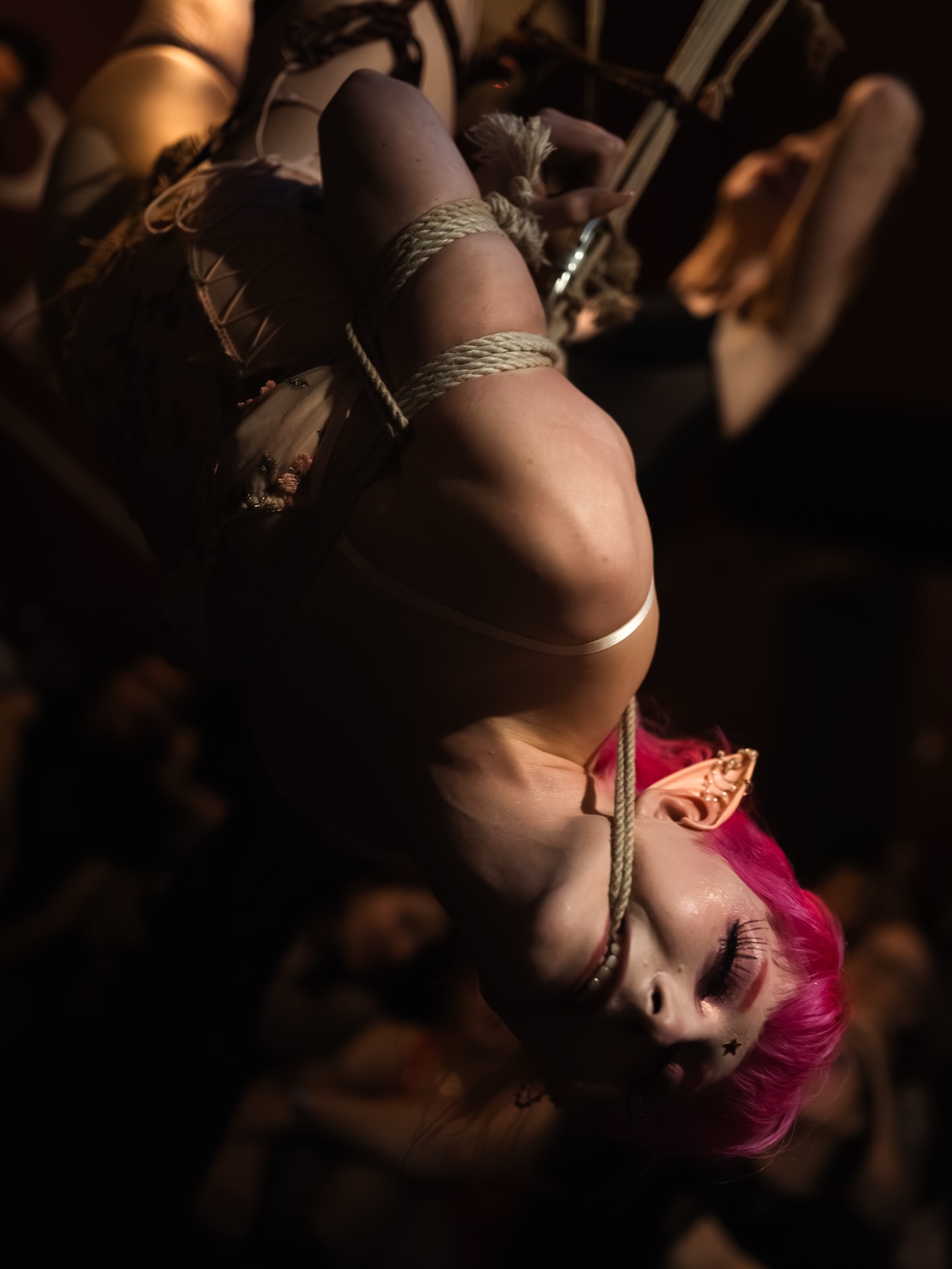 Suspension, pink hair, candlelight